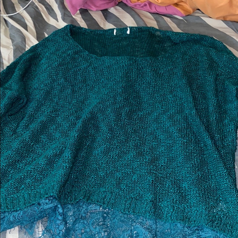 Blue long sleeve shirt with lace on the bottom